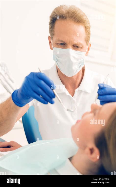 Dentist examining teeth