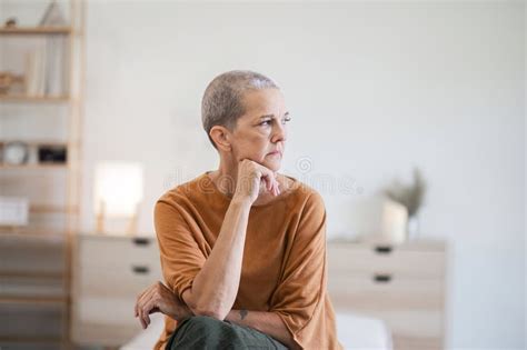 Elderly woman deep in thought