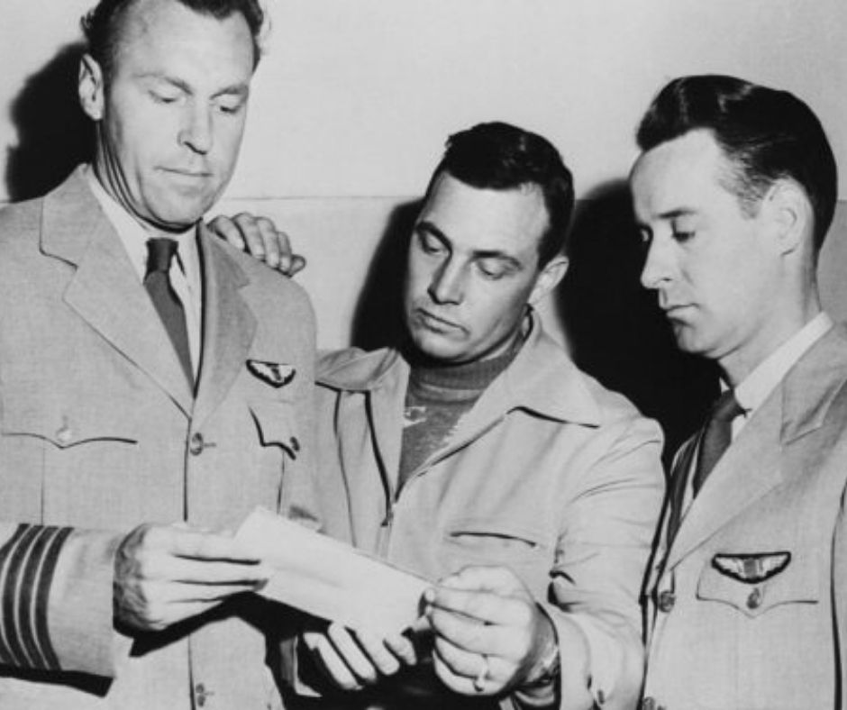 The picture shows pilots E.J. Smith, Kenneth Arnold, and Ralph E. Stevens look at a photo of an unidentified flying object they sighted while en route to Seattle, Washington, 1947. Credit: Bettmann Archive/Getty Images.