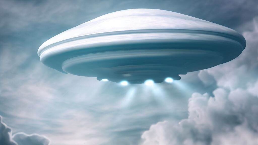 A white ufo in the clouds.